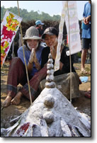 Praying in front of our sand stupa